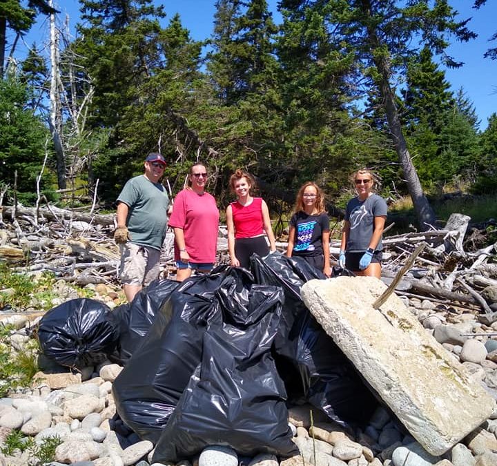 ‘Moonbeam’ Crew and Volunteers Clean 21 Bags of Plastic from Island Shores
