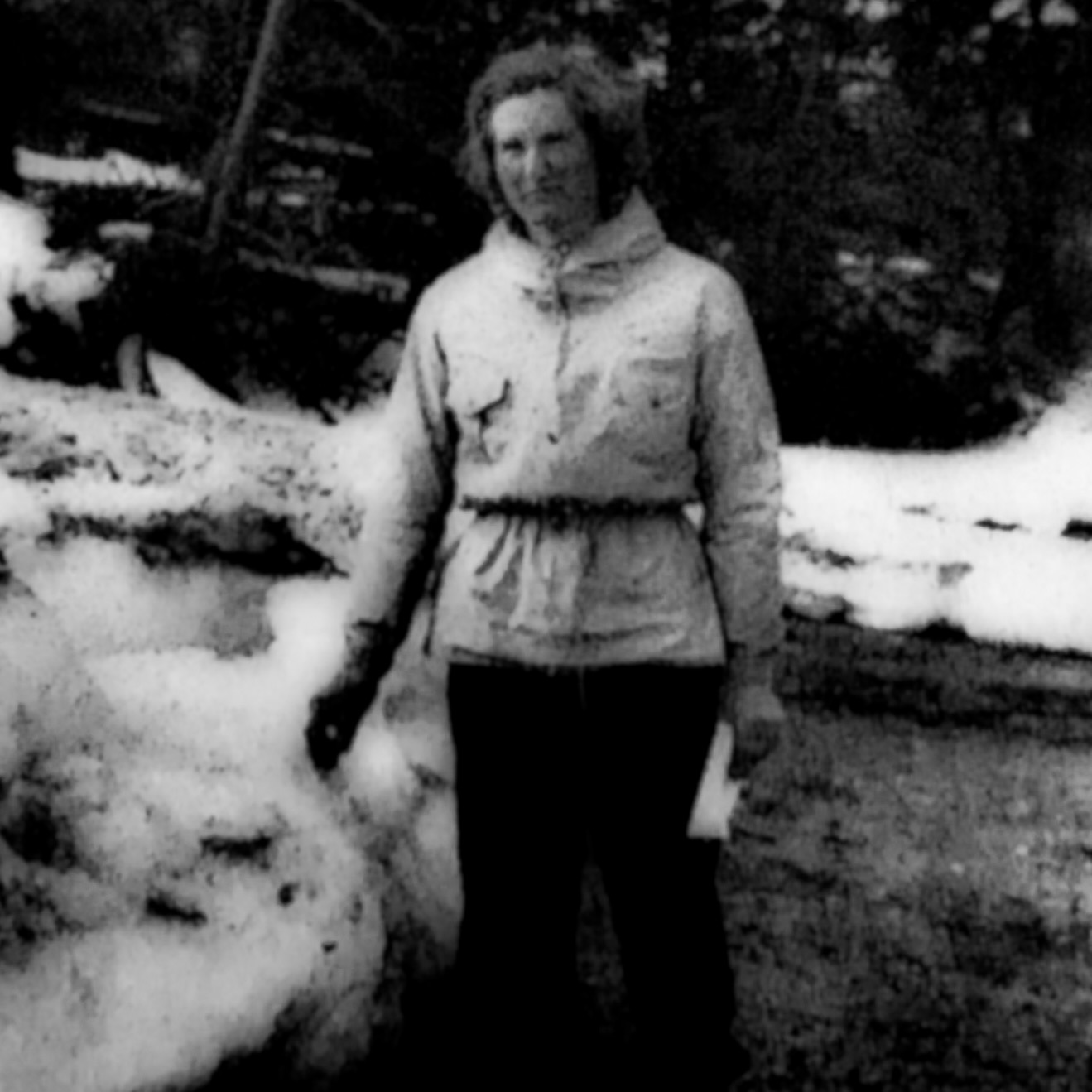 Black and white photo of Edith P. Drury surrounded by snow.