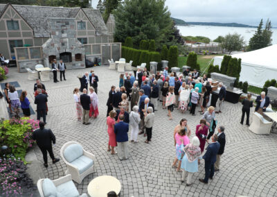 Color photo shot from overhead of Gala guests on the Bar Harbor Club veranda.