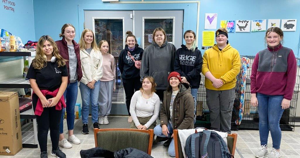 A color photo Journey students at the Ark Animal Shelter
