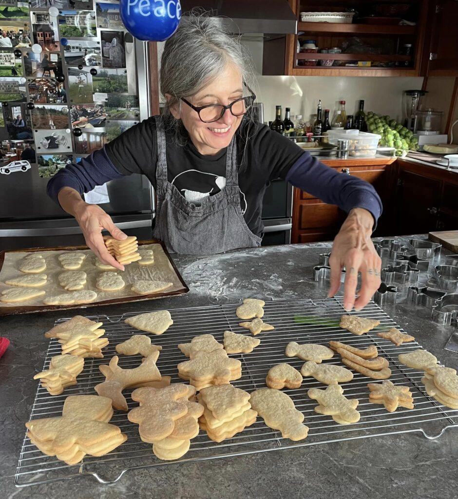 A color photo of a person making cookies