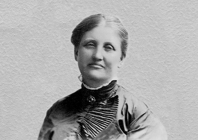 A black and white photo of a woman looking at the camera