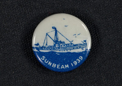 A small pin that reads Sunbeam 1939 with a drawing of Sunbeam III on it