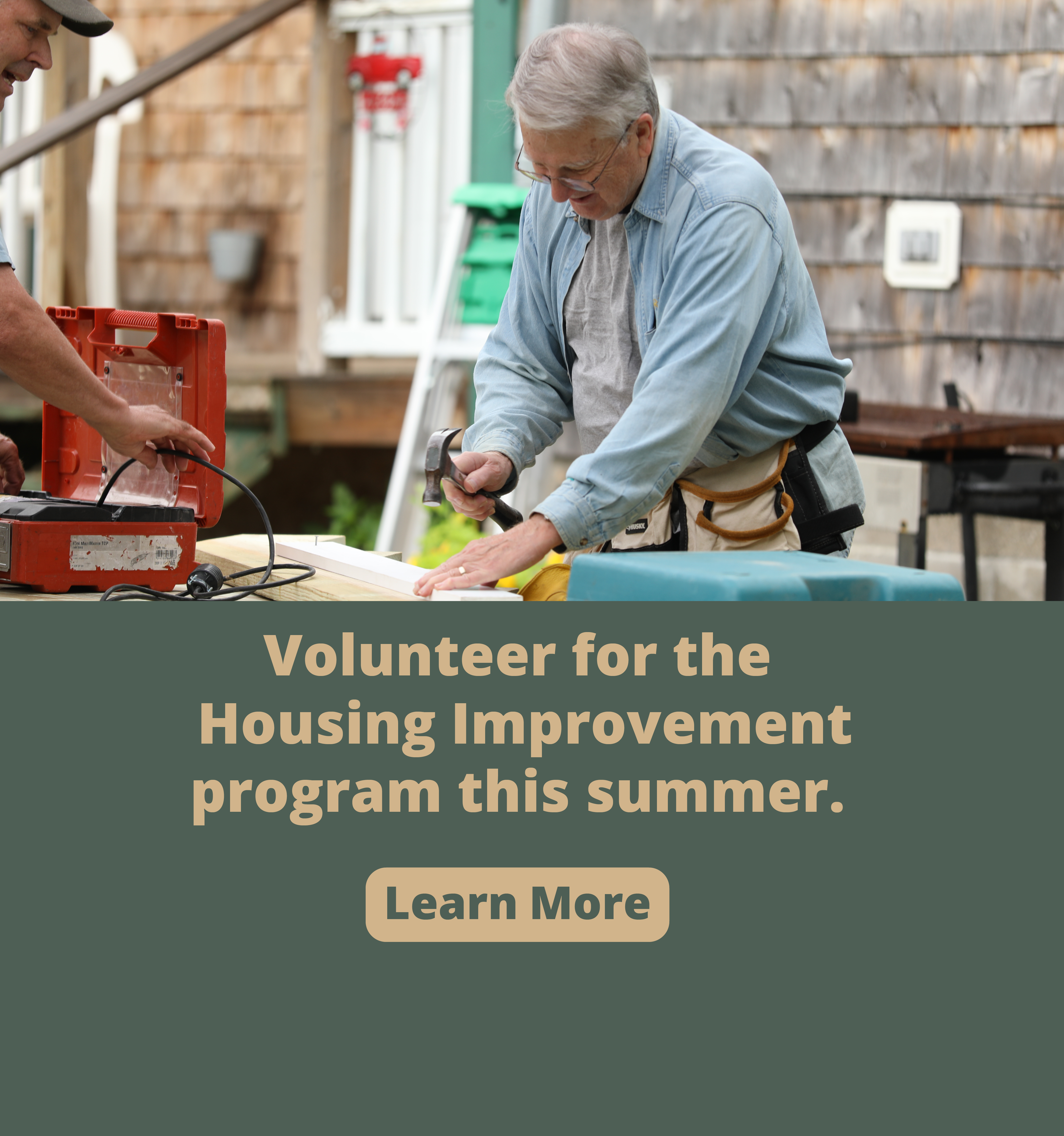 An older man hammers a piece of wood. Next to him is a banner that says "Volunteer for the Housing Improvement Program this summer. Learn More" Click to learn more.