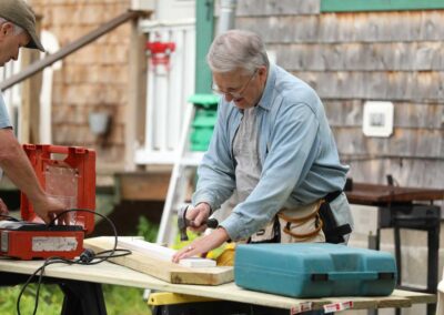 A Housing Improvement volunteer works on a project that will make a home warm, safe, and dry.