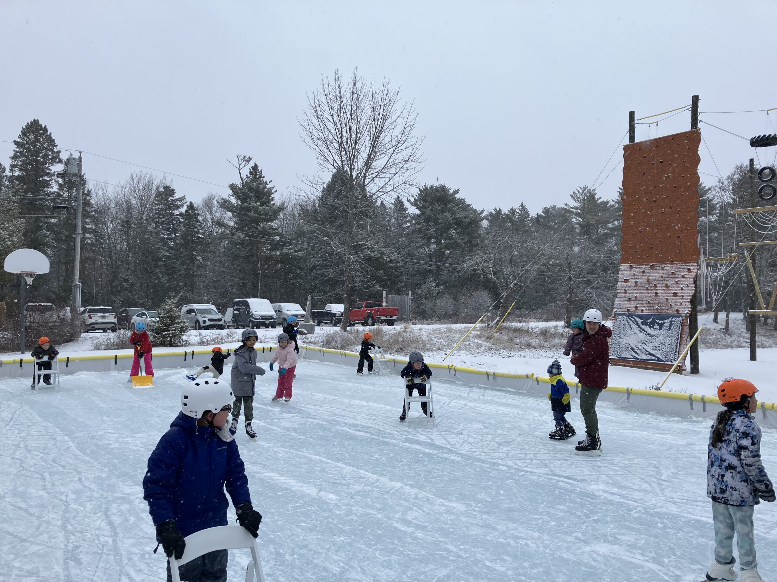 Families ice skating on the Downeast campus