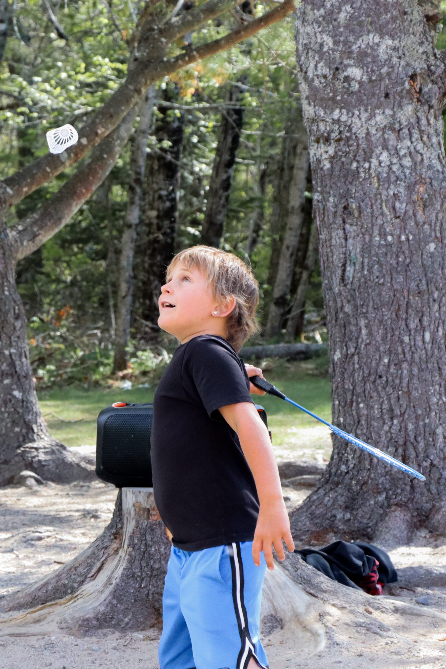 Boy playing tennis at Harrington after school EdGE