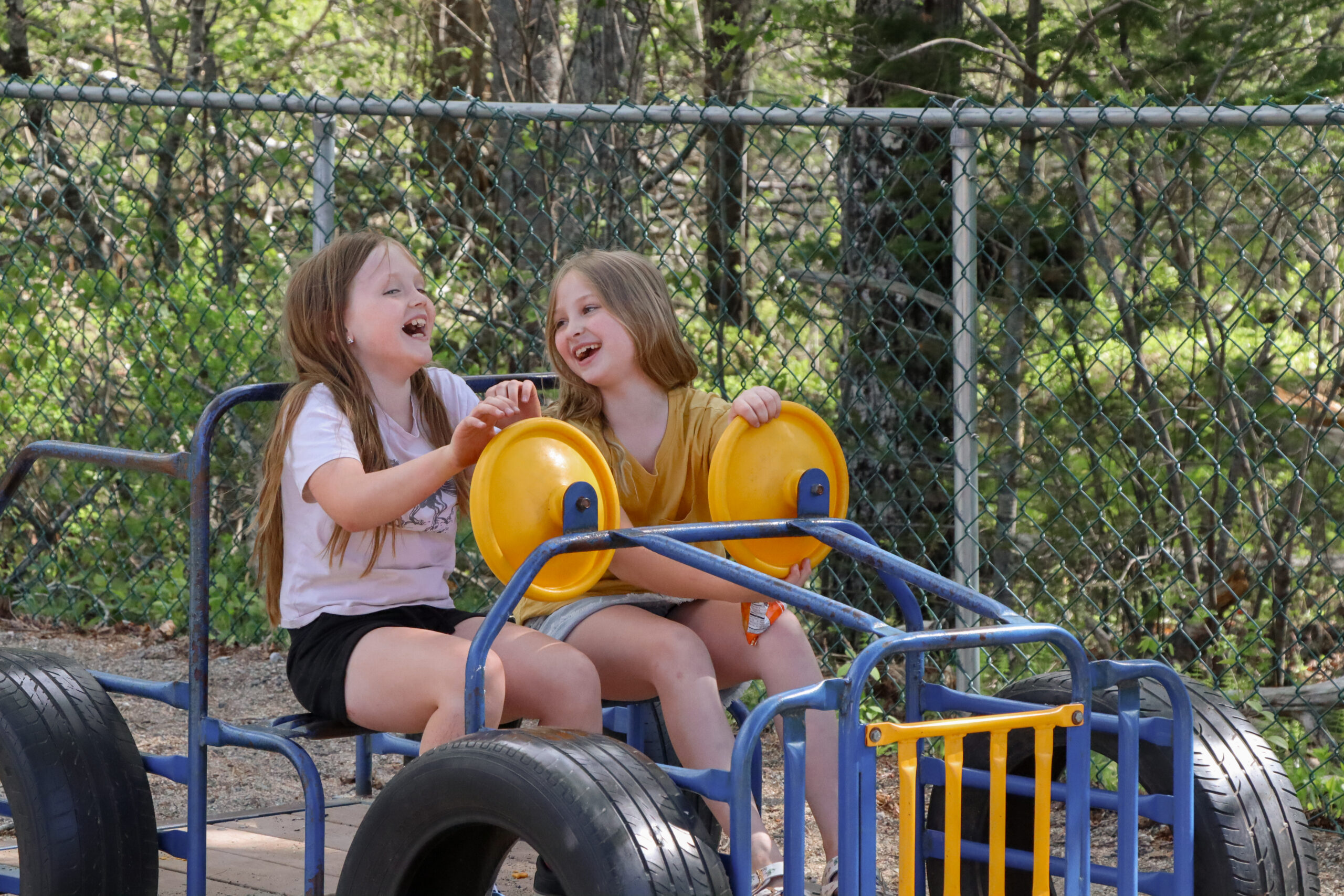Girls on playground at Harrington EdGE laughing